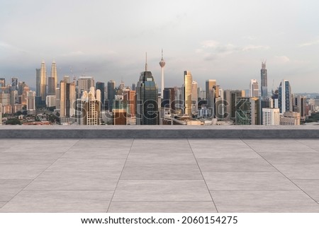 Panoramic Kuala Lumpur skyline view, concrete observatory deck on rooftop, sunset. Asian corporate and residential lifestyle. Financial city downtown, real estate. Product display mockup empty roof Royalty-Free Stock Photo #2060154275