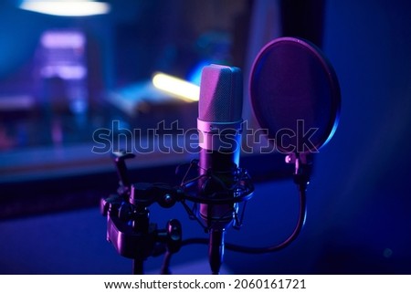 Close-up of microphone standing in the recording room to record songs
