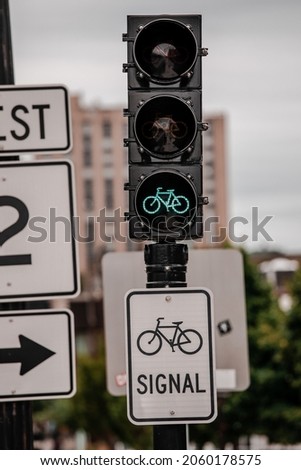 Signs and traffic lights help control traffic flow on intersections in Boston.