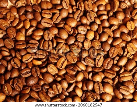 Roasted coffee beans lying on the table.