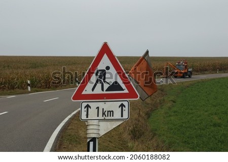 Mowing work on a federal road in Germany.