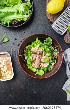 Cod liver salad mix petals lettuce leaves fish fat seafood omega-3 vitamin aperitif fresh meal snack on the table copy space food background keto or paleo diet veggi vegetarian pescetarian diet