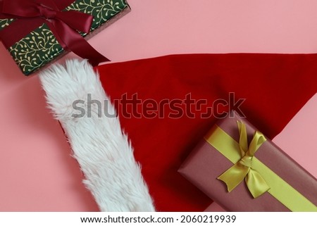 The gift boxes for Christmas season on the pink background.