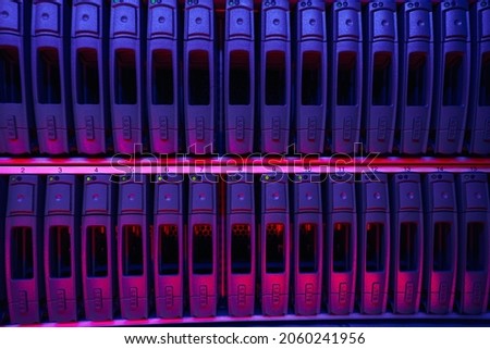 Data storage device positioned on server racks Royalty-Free Stock Photo #2060241956