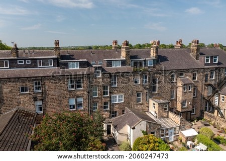 Aerial drone photo of the beautiful historical town of Harrogate, North Yorkshire in the UK showing the residential housing estates and rows of houses from above in the summer time