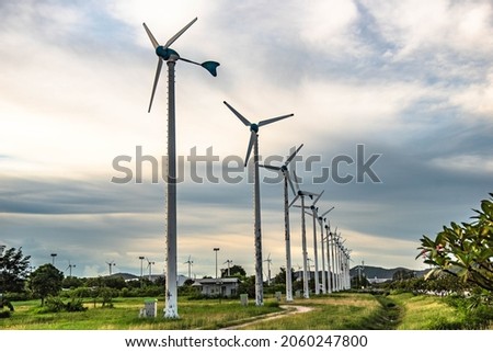 Wind turbines used to generate electricity in Laem Chabang deep sea port, Thailand Royalty-Free Stock Photo #2060247800