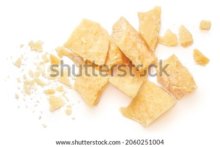 Pieces of parmesan cheese isolated on white background. Parmesan chunks with crumbs  top view Royalty-Free Stock Photo #2060251004