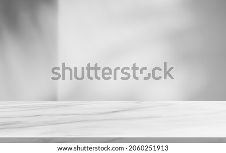 Marble gray floor shelf Stage and blurred Shadow leaves on cement wall Background well editing Display product Advertising and text present on free space Backdrop 