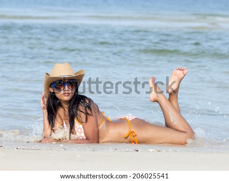 Attractive woman lying on beach
