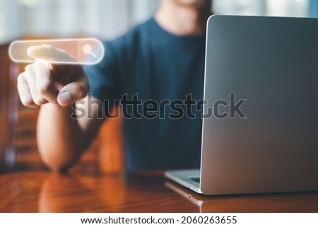 Search Engine technology. Virtual image. Man using computer laptop, Pointing searching internet network for job, information, Big data, browser website concept. Hand touching bar search box icon.