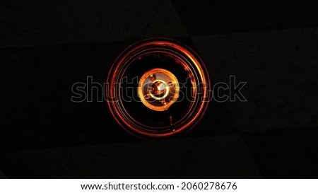 Candles on a restaurant table on a black background  Royalty-Free Stock Photo #2060278676