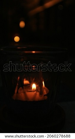 Candle in glass with blur background Royalty-Free Stock Photo #2060278688