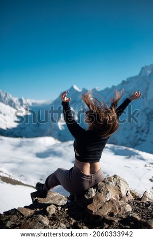 Tourism, traveling and healthy lifestyle concept. Travel Lifestyle wanderlust adventure concept summer vacations outdoor alone into the wild. The girl is standing on the top of the mountain