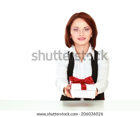 Business woman with gift box red bow sitting at the desk
