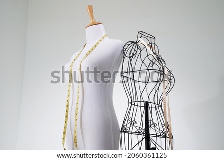 Stylish wire tailor's mannequin and  vintage manniquin  Royalty-Free Stock Photo #2060361125