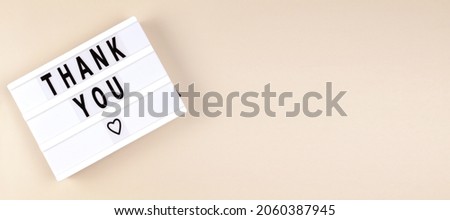 Creative Top view flat lay lightbox with the text thank you. Horizontal long banner for web design with copy space