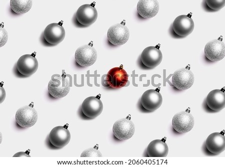 Red and silver shiny Christmas baubles on a pink pastel background. Christmas decorations. Minimal composition seamless pattern background. Winter, Cristmas and New year concept. Top view, flat lay Royalty-Free Stock Photo #2060405174