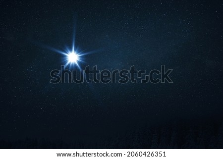 The star shines over the manger of Christmas of Jesus Christ. Bethlehem illuminated by Christ's Christmas star