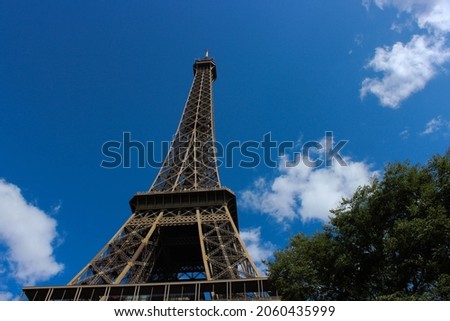 The Eiffel Tower Paris France. View From Down Of Eiffel Tower. Eiffel Tower With Blue Sky Background 