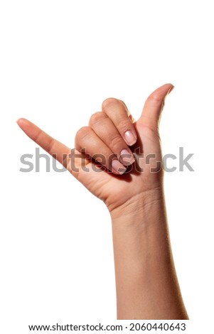 Sign language, the letter Y. Isolated on white background. Woman's hand with the gesture of the letter Y in sign alphabet.