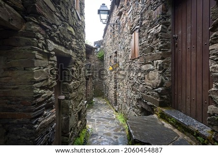 a street with traditional old houses at Talasnal Schist Village, Serra da Lousa, Lousa, Portugal Royalty-Free Stock Photo #2060454887