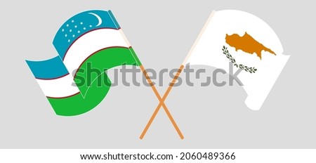 Crossed and waving flags of Uzbekistan and Cyprus