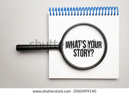 Magnifying glass with the word What's your story on chart background