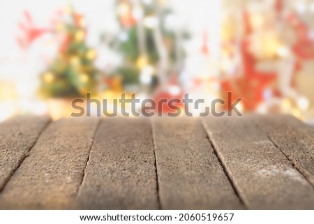 Rustic wood table in front blurred Christmas object background