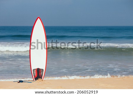 Surfboard in the Sand Royalty-Free Stock Photo #206052919