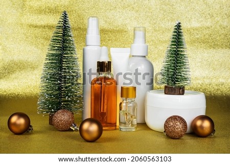 Care cosmetics for women's holidays. Copy space with night, day cream cosmetic oil, eye cream on light yellow brilliant glamorous background. Unbranded bottles in mockup style. Beauty background