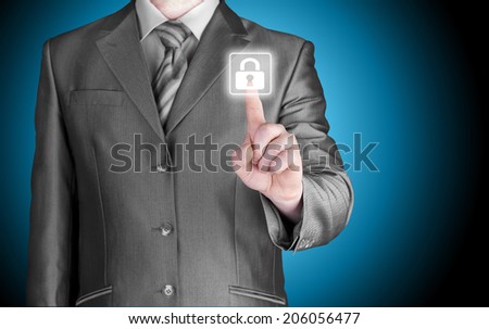 Businessman pushing virtual security button