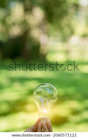 Light bulb Energy saving green nature background