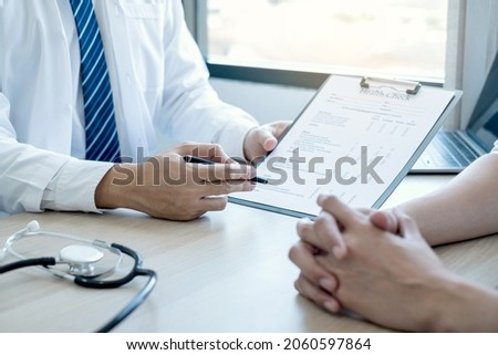 Man doctors explain and recommend treatment after a female patient meets a doctor and receives results regarding illness problems. Medical and health care concepts.