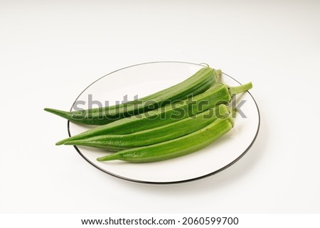 Macro shot of okra on white background