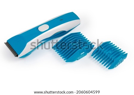 Electric wireless rechargeable pet clipper with nozzles for steps cutting length adjustment on a white background
 Royalty-Free Stock Photo #2060604599