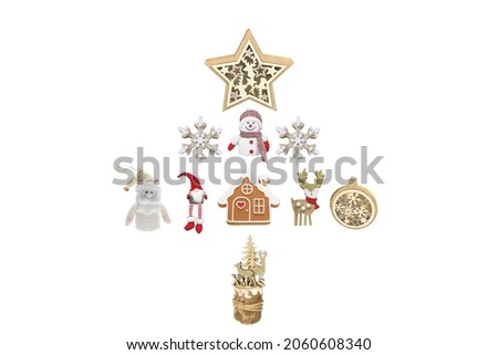 CHRISTMAS FIGURINES ISOLATED ON A WHITE BACKGROUND, laid out in the shape of a fir tree, top view