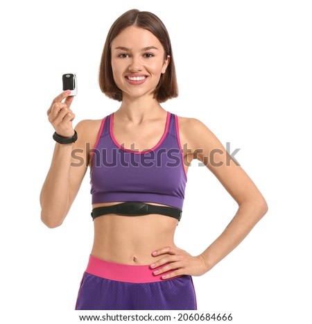 Sporty young woman with pulse oximeter on white background Royalty-Free Stock Photo #2060684666