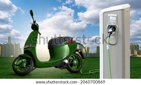 Electric scooter with charging station on a background of cityscape Royalty-Free Stock Photo #2060700869