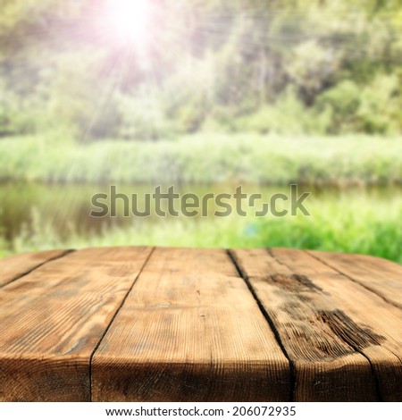 wooden table and river 