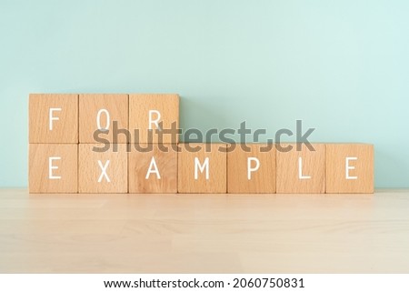 Wooden blocks with "FOR EXAMPLE" text of concept.