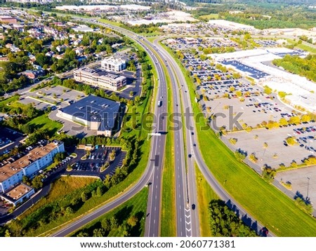 The top view of transporation, the cars are moving on highway road from very far away view.