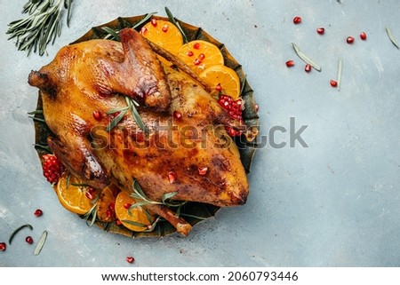 Roast duck with orange, rosemary, berry and spices. banner, menu, recipe place for text, top view.
