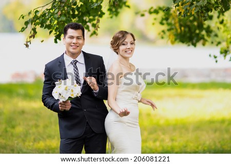 Wedding couple together in park