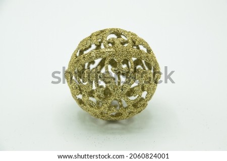 Christmas tree golden bauble with relief in a white background