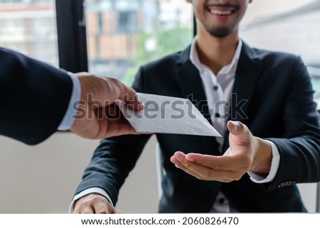 Bonus. boss giving money bonus in paper envelope to business man worker employee for increasing of salary or promotion new position in meeting room office, unemployment, business company concept