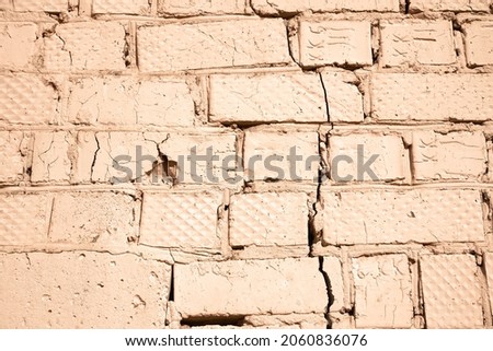    Old brick wall, old texture of red stone blocks closeup                            