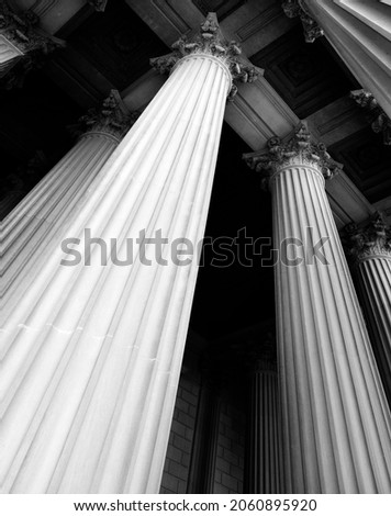 Columns on museum or courthouse building representing strength and support Royalty-Free Stock Photo #2060895920