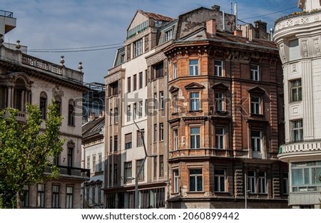 Exterior view of historical old town buildings in the downtown of Budapest, Hungary, Eastern Europe. Colorful houses in the V. district, the true inner city of Pest. Royalty-Free Stock Photo #2060899442