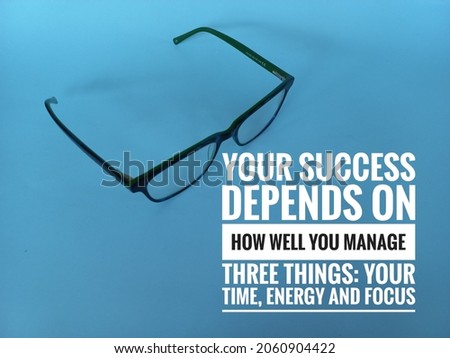 eyeglasses on the blue background with inspirational quotes