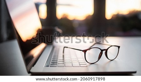 Place of work, home office, laptop computer and eyeglasses at office desk. Business, finance, studying, management, internet marketing, learning online, leadership, working from home, entrepreneur